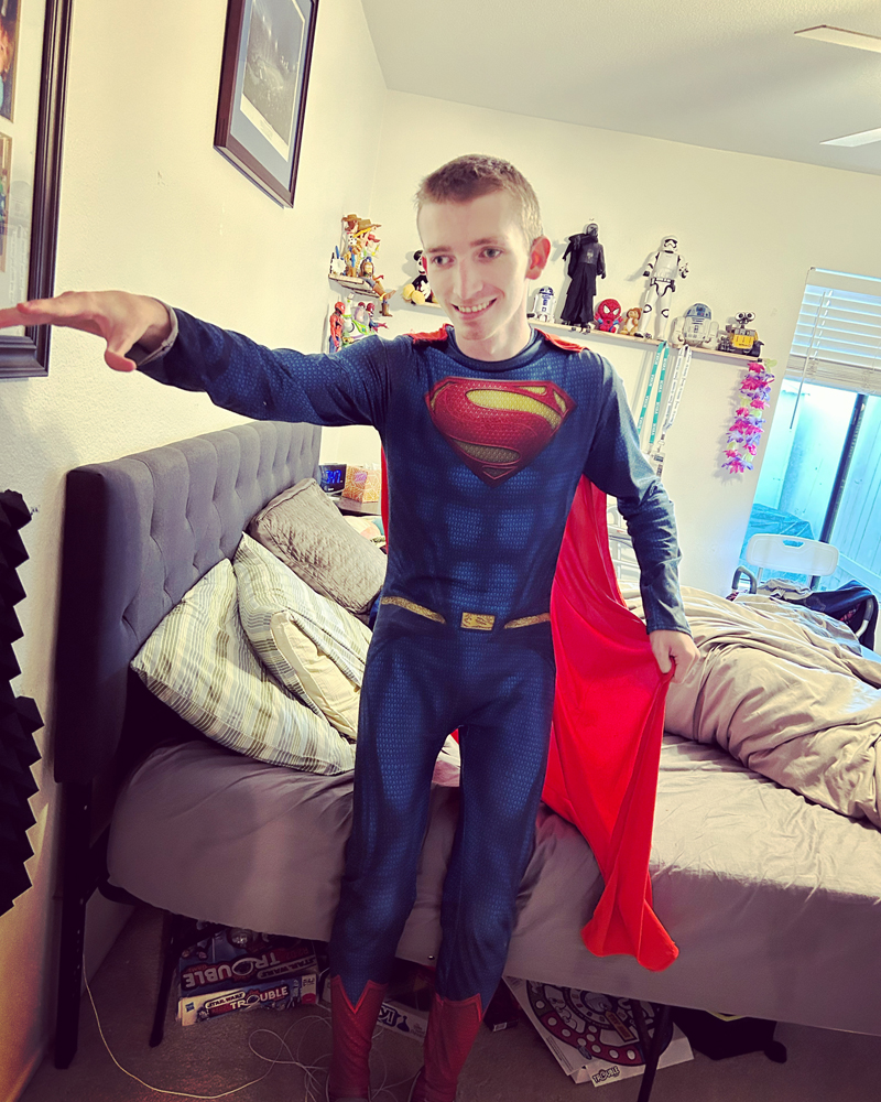Teen Boy Dressed In Superman Costume